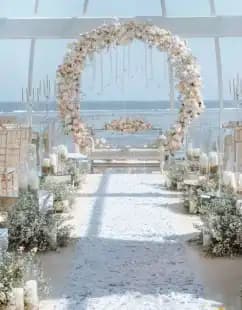 wedding ceremony with flower arch